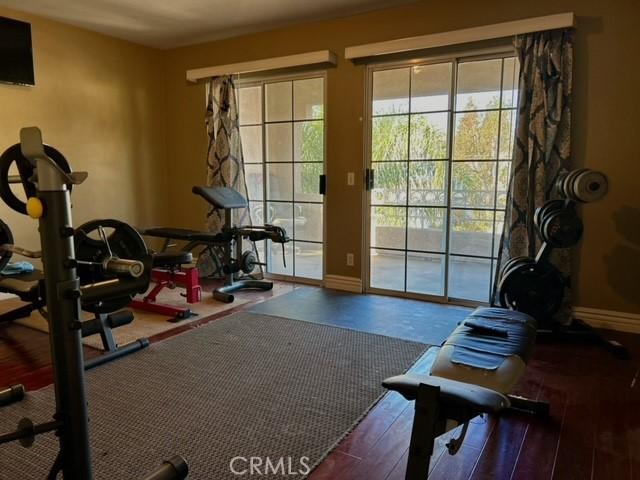 exercise area featuring hardwood / wood-style flooring