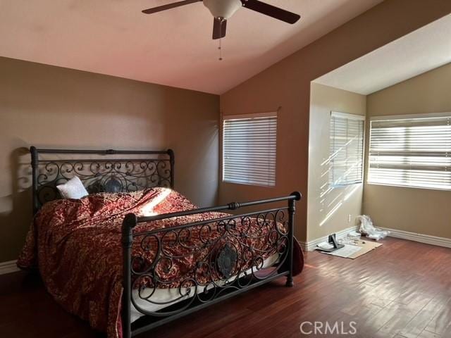 bedroom featuring hardwood / wood-style floors, ceiling fan, and vaulted ceiling