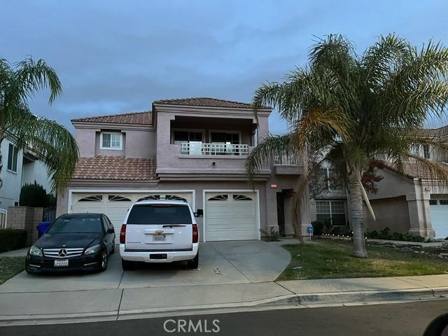 view of front facade with a balcony and a garage