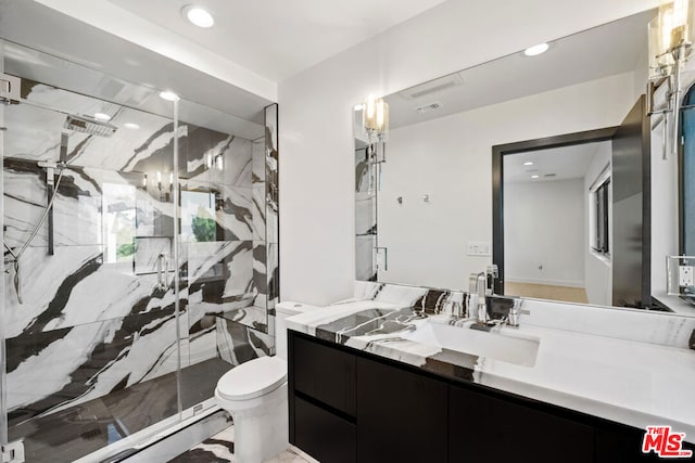 bathroom featuring toilet, vanity, and walk in shower