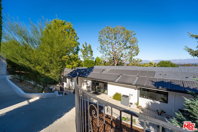 view of property exterior featuring a mountain view