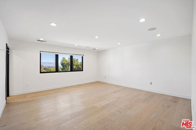 empty room featuring light hardwood / wood-style floors