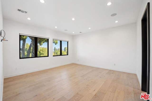 empty room with light wood-type flooring