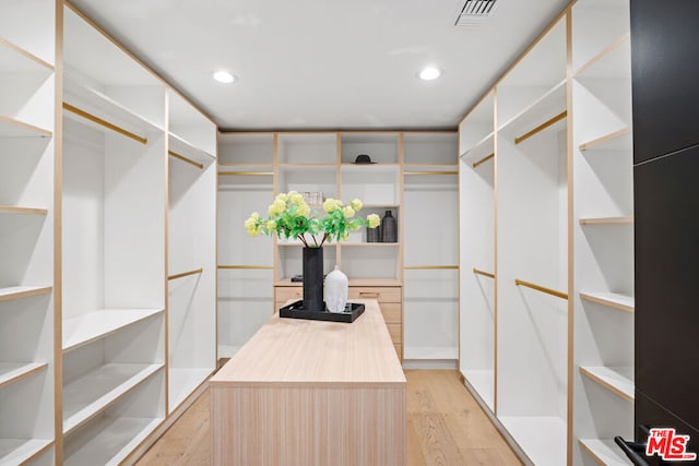 walk in closet featuring light wood-type flooring