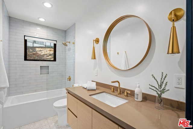 full bathroom with tile patterned floors, vanity, toilet, and tiled shower / bath