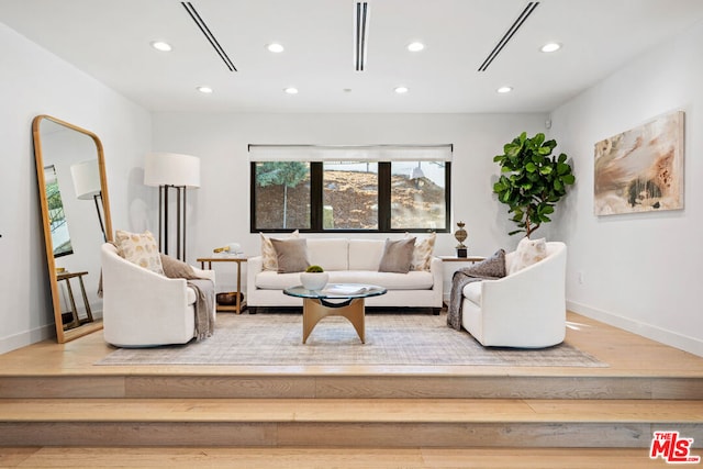 living room with light hardwood / wood-style flooring