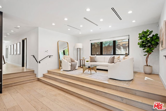 living room with light hardwood / wood-style floors