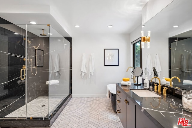 bathroom featuring vanity and an enclosed shower