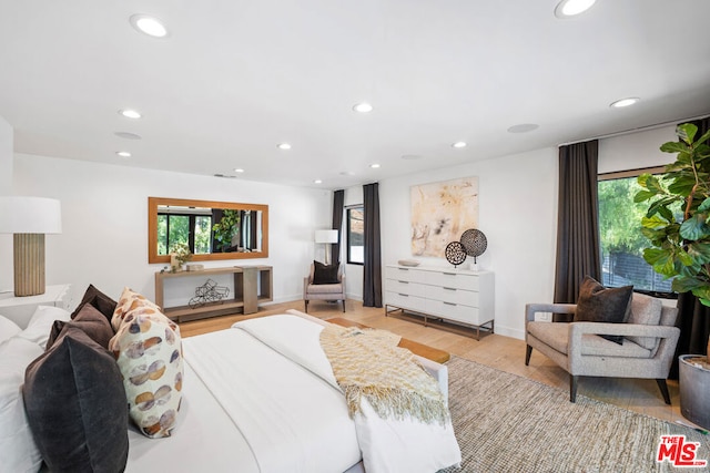 bedroom with light hardwood / wood-style floors