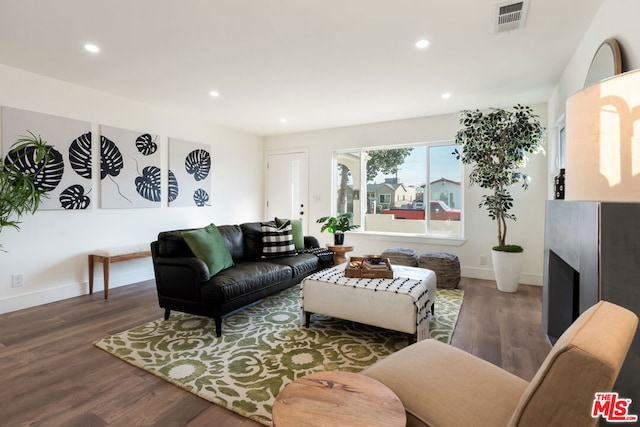 living room featuring dark hardwood / wood-style floors