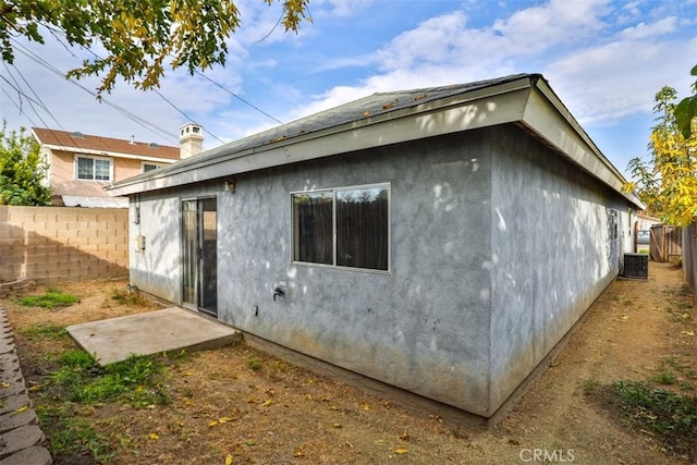 view of property exterior featuring central AC