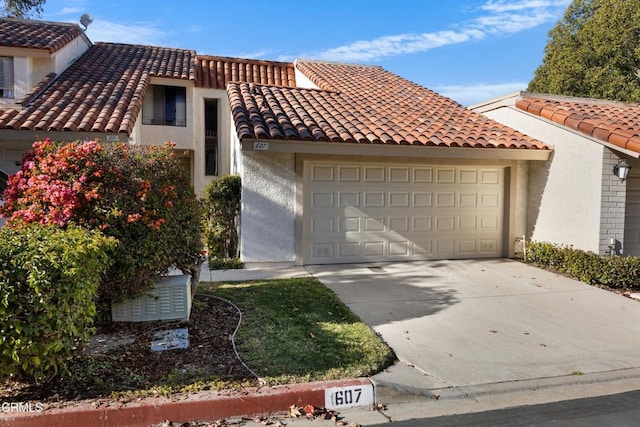 mediterranean / spanish-style house featuring a garage