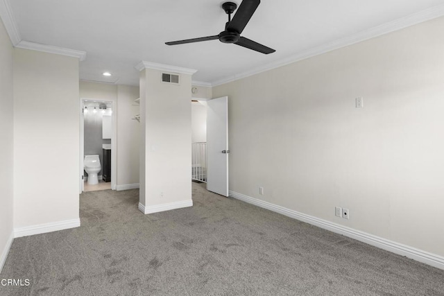 unfurnished bedroom with ensuite bath, ceiling fan, light carpet, and ornamental molding