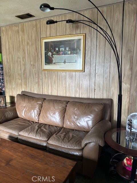 living room featuring wood walls