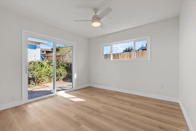 spare room with light hardwood / wood-style flooring and ceiling fan