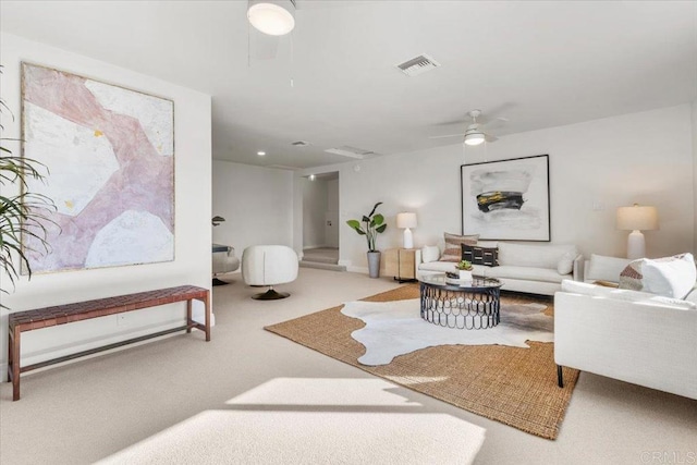 living room with ceiling fan and carpet floors