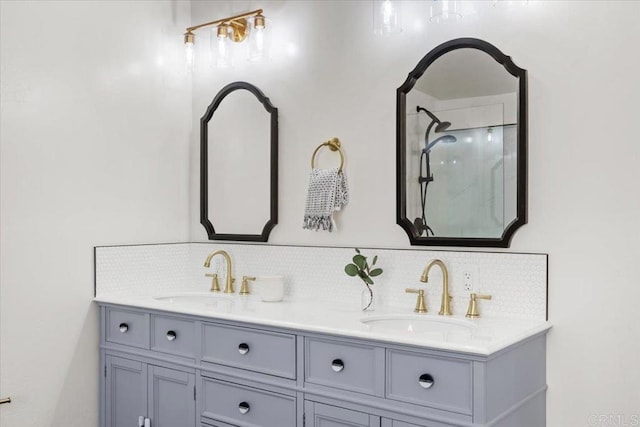 bathroom with vanity, decorative backsplash, and walk in shower