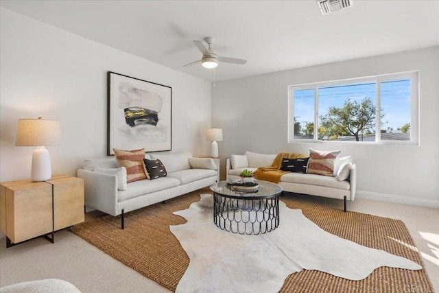 living room with carpet flooring and ceiling fan