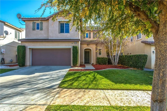 view of front of house with a garage and a front lawn