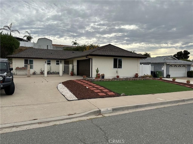 single story home featuring a front lawn and a garage