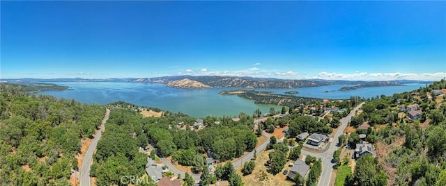 bird's eye view with a water and mountain view