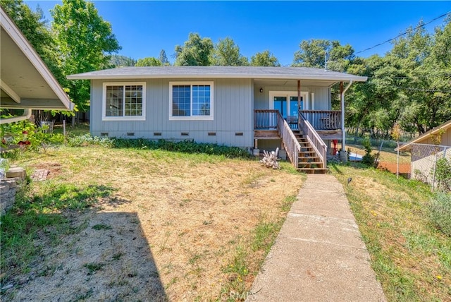 bungalow with a porch and a front yard