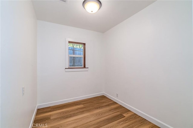 empty room featuring hardwood / wood-style flooring