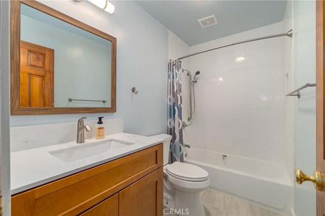 full bathroom with vanity, toilet, and shower / bath combo