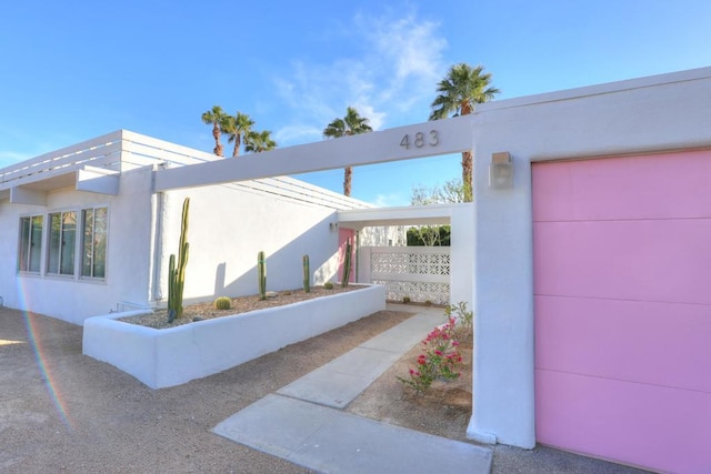 view of side of home with a garage