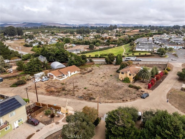 birds eye view of property featuring a mountain view