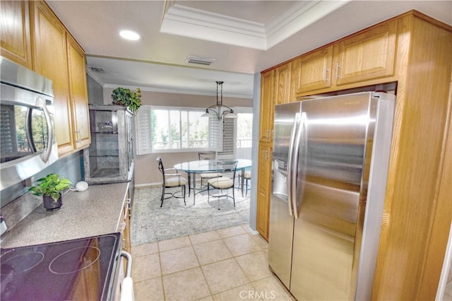5362 Algarrobo Unit 2O, Laguna Woods, CA 92637 - kitchen featuring crown molding, stainless steel appliances, and visible vents