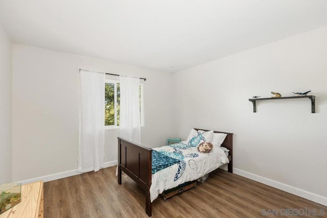 bedroom featuring hardwood / wood-style floors