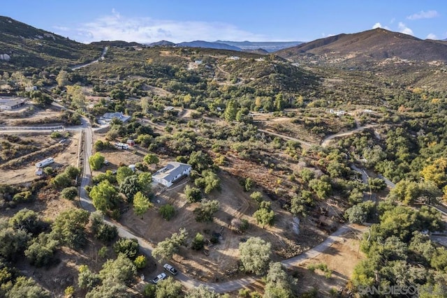 birds eye view of property with a mountain view