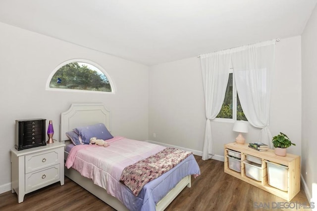 bedroom featuring dark hardwood / wood-style flooring