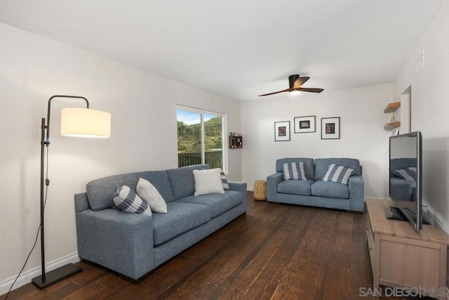 living room with dark hardwood / wood-style floors and ceiling fan