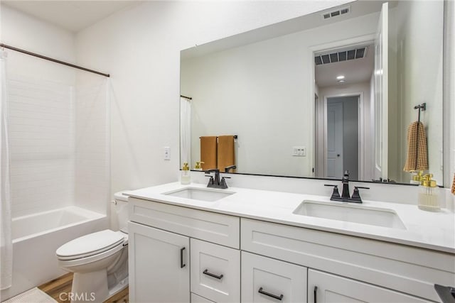 full bathroom featuring hardwood / wood-style floors, vanity, toilet, and shower / bath combo with shower curtain