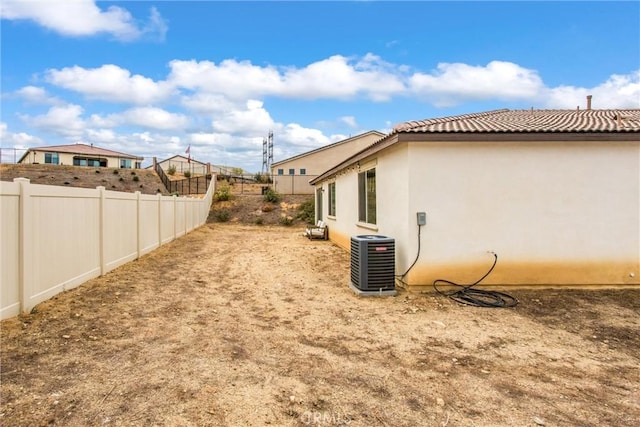 view of yard with central AC