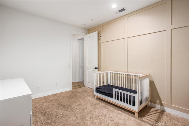 unfurnished bedroom featuring light colored carpet