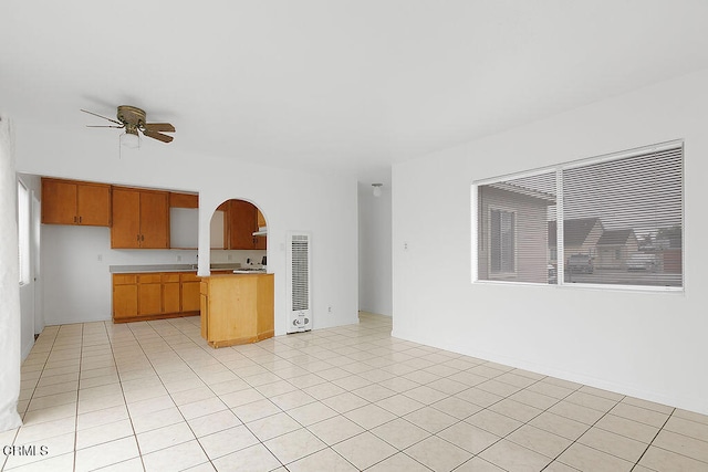 kitchen with ceiling fan and light tile patterned floors