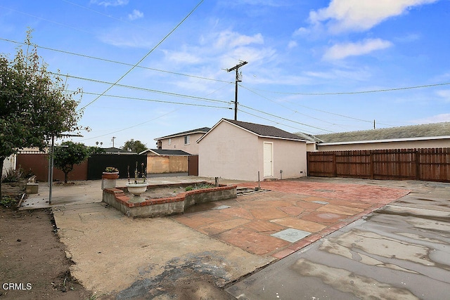 view of patio / terrace with an outbuilding