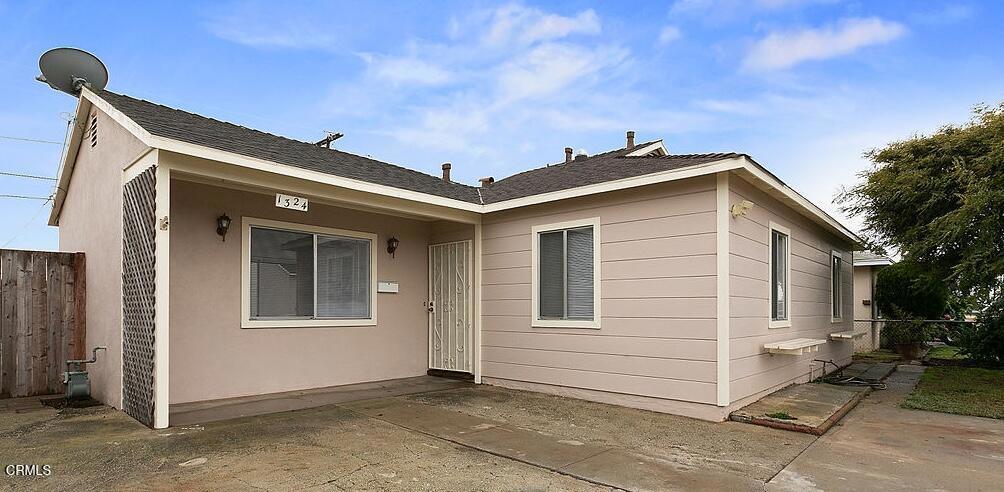 back of property with a patio