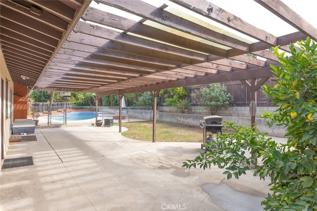 view of patio featuring grilling area, a pergola, and a fenced in pool