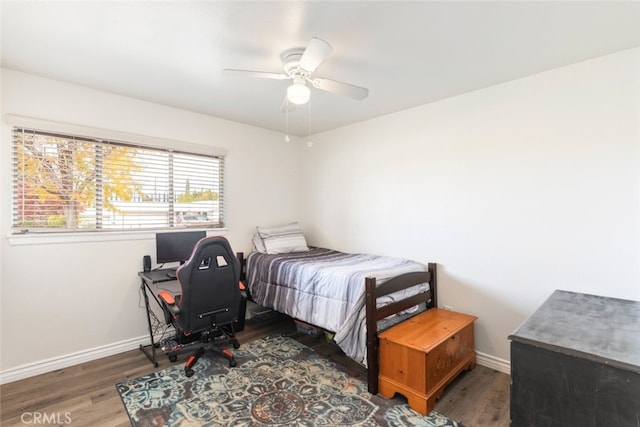 bedroom with dark wood-type flooring and ceiling fan