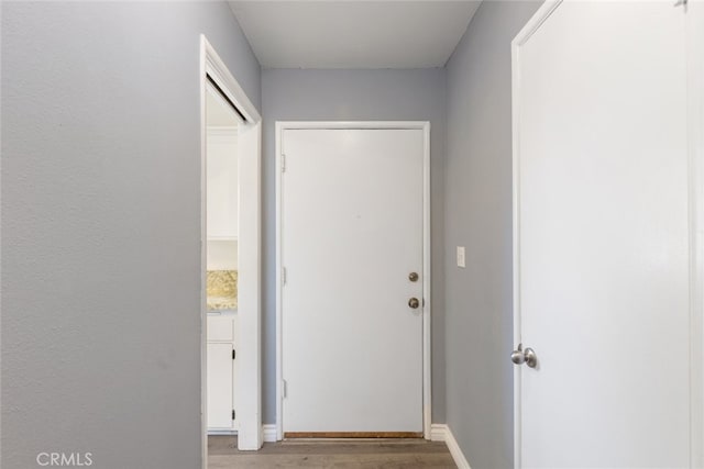 hall with light hardwood / wood-style floors