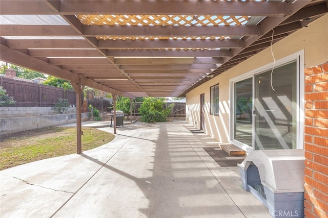 view of patio / terrace with grilling area and a pergola