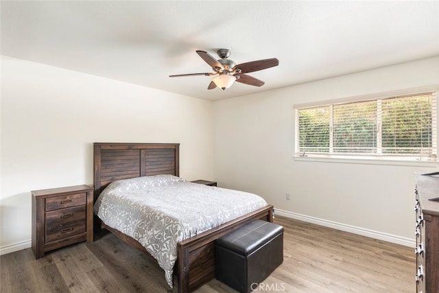 bedroom featuring ceiling fan and light wood-type flooring