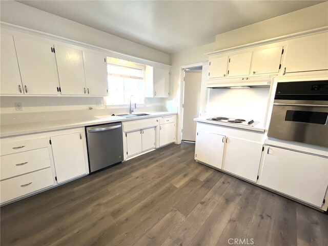 kitchen with white cabinets, dark hardwood / wood-style floors, sink, and stainless steel appliances