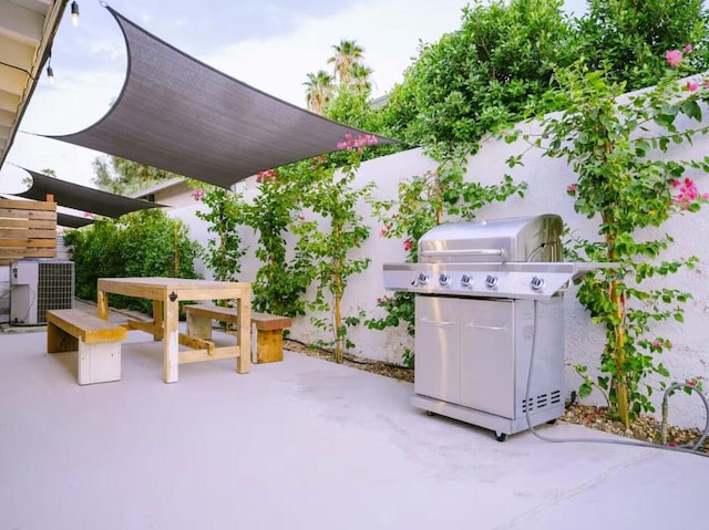 view of patio / terrace with area for grilling and central AC unit