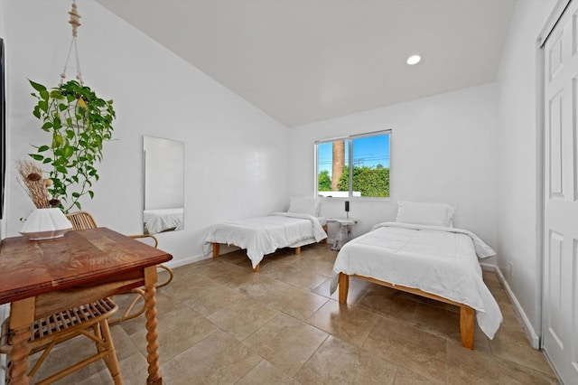 bedroom with lofted ceiling