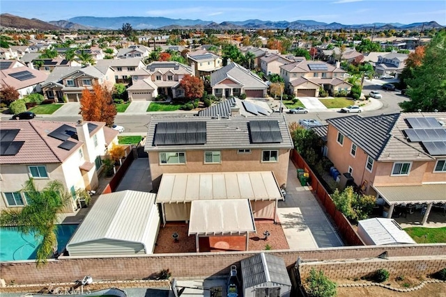 birds eye view of property featuring a mountain view